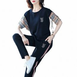 Printemps et été nouveau costume décontracté Fi coréen épissage couleur sport manches courtes haut court pantalon crayon deux pièces ensemble K5ts #