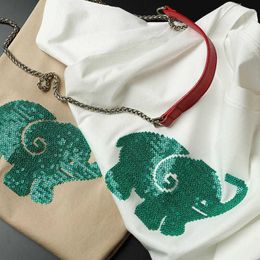 Damen-T-Shirts, Pailletten-Stickerei, Flut, niedlicher grüner Baby-Elefant, dreidimensionales weißes Hemd, weiblicher Frühling und Sommer