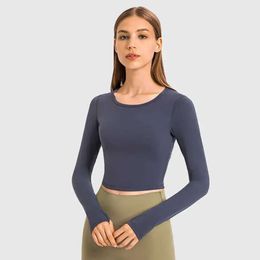 Hauts pour femmes élastique court mince Yoga vêtements de sport mode col rond à manches longues couleur unie T-shirt course Fiess chemise d'entraînement 688ss 2023