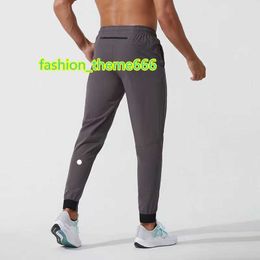 Dames Trainingspakken LL Heren Jogger Lange Broek Sport Yoga Outfit Sneldrogend Trekkoord Gym Zakken Joggingbroek Broek Heren Casual Elastische taille fitness