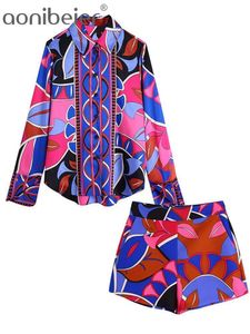 Pantalones de dos piezas para mujer Aonibeier Summer Women Chic Estampado geométrico Trajes de color rosa Traf Top Blusa High Low Hem Shirt Shorts Mujer Conjuntos de 2 piezas 230206