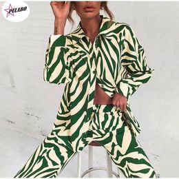 Pantalon de deux pièces pour femmes Pulabo Stripe Stripe Femmes Shirt Set Elegant Long Mancheve Top et pantalon de taille haute élastique