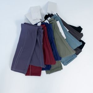 Les pantalons de yoga pour femmes alignent les collants multi-poche à taille haute brossée à double face coulant avec des cultures de points réfléchissantes