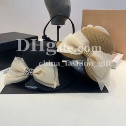 Mujeres Diseñadora de sombrero de paja Organza Bow Hat Damas Elegantes sombrero de cubo de cubo Summer Sol Prevención de sombrero Viaje Sun Shade Straw Sombrero de paja