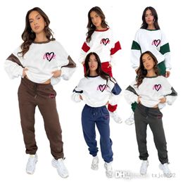 Mujeres Spares de pistas Dos piezas Diseñador Nuevo producto de invierno de otoño Invierno Peach Heart Bloque de color impreso Sweater Fashion Pants casual Set