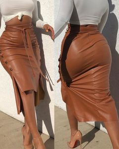 Femmes à la mode en cuir PU jupe mi-longue couleur unie taille haute à lacets bouton latéral mince jupe crayon maigre pour dames Streetwear X0428