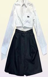 Femmes039s jupe chemise courte mode avec paquet en nylon style triangle inversé dame robe sexy de haute qualité taille noire SL6967968