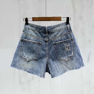 Shorts en jean pour femmes shorts de mode bleu A-line lavé en détresse