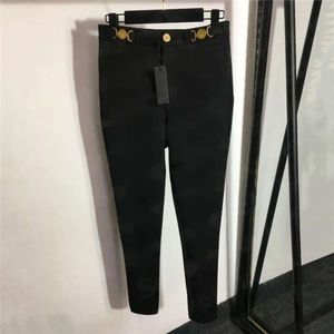 Designer femme slim collants pantalons en métal boutons pantalon pant