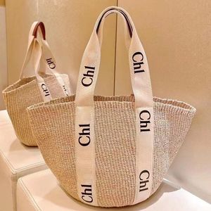 Paja el tote Raffias Woody Basket Bolsa de diseñador 7A Bolso de lujos para mujer Tejido de ganchillo Tienda de playa Bolsas de hombro para hombre Cubo de verano Embrague Crossbody Bolsa de mano