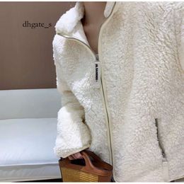 Veste North Face pour femme Automne/Hiver Nouveau manteau en laine d'agneau avec fermeture éclair à col debout et article à la mode Série de couleurs chaudes Milk Huhu