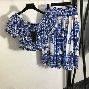 Traje para mujer Conjunto de dos piezas azul Ropa de verano Estampado de moda Cuello redondo Top de manga corta Falda plisada transpirable suelta Faldas de longitud media Trajes de diseñador Mujer 2 piezas