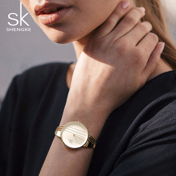 Reloj para mujer, relojes de alta calidad, moda de lujo, creativo reloj con rayas, minimalista, reloj de cuarzo resistente al agua de dos pines