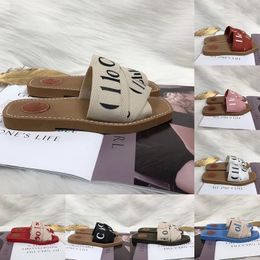 Sandalias leñosas para mujeres Damas Canvas de tela Mulas Sandalia de diseñador Tisos bajos Fashion Luxury Luxury Summer Casual zapatillas para mujeres Tobas de madera 35-41