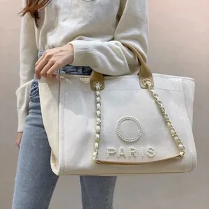 Les sacs fourre-tout Sacs de créateurs de luxe Grands sacs fourre-tout fourre-tout Bolso 10A Haute Qualité CC Perles Toile Cowboy Sacs à bandoulière Mode féminine Sacs Dhgate