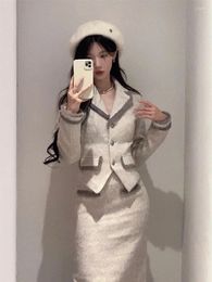 Robes de travail Tempérament français Veste en laine Hipo Wrap Skir Two-Piece Set Femmes Fashion Tassel Soft Celebrity Slim chic Hiver Suit