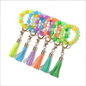 Porte-clés de poignet en silicone, bracelet de perles, cadeau de fête, pompon fluorescent, porte-clés qui brille dans le noir, pendentif féminin, porte-clés, porte-bracelet BC409