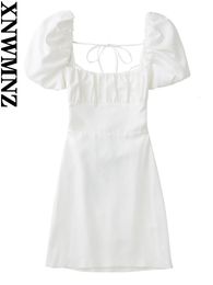 Xnwmnz vrouwen witte mode linnen mix jurk vrouwelijke vierkante nek korte pieiermouwen backless crossover riemen voor dames 240415