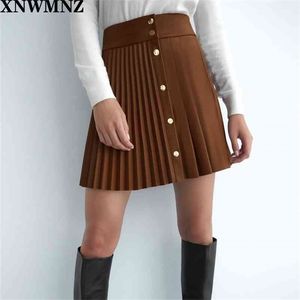 XNWMNZ Za Mujeres Falda de cuero de imitación plisada Femenina Mini faldas sexy con botón de presión de metal Cierre frontal 210621