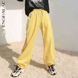 Pantalon de taille haute asymétrique avec fermeture éclair épissé jaune, pantalon ample pour femme, mode marée printemps automne 210427