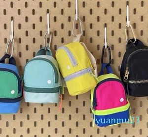 Bolsas de yoga estilo clave Mini mochila con cadena monedero bolsa de efectivo bolsa de dulces colores surtidos decorativos con entrega de cintura Spo