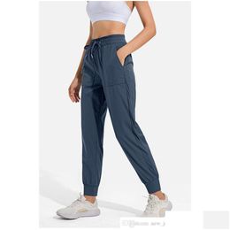 Yoga Outfit LL Femmes Jogging Neuvième Pantalon Poche Fitness Leggings Doux Taille Haute Hip Lift Élastique Casual Dstring Jambes Pantalons de survêtement2344 D Otygt