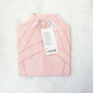 Tenue de yoga nouvelle veste à manches longues pour femmes couleurs solides sports nus forme de la taille serrée de jogging lâche de jogging