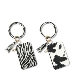 Zebra-Stripe PU Pulsera de cuero Llavero con bolsa de tarjeta Borlas Colgante Estampado de vaca Bolsas de muñeca portátiles Cremallera Suministros para fiestas T2I51993